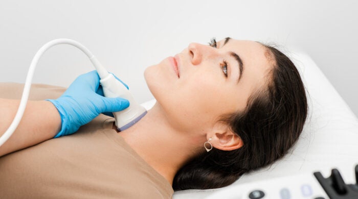 Female patient receives thyroid diagnostics. Treatment of thyrotoxicosis, and hypothyroidism