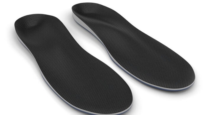 Orthotics - custom made shoe inserts isolated on white