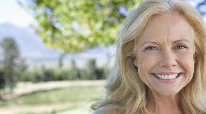 Portrait of smiling mature woman in park